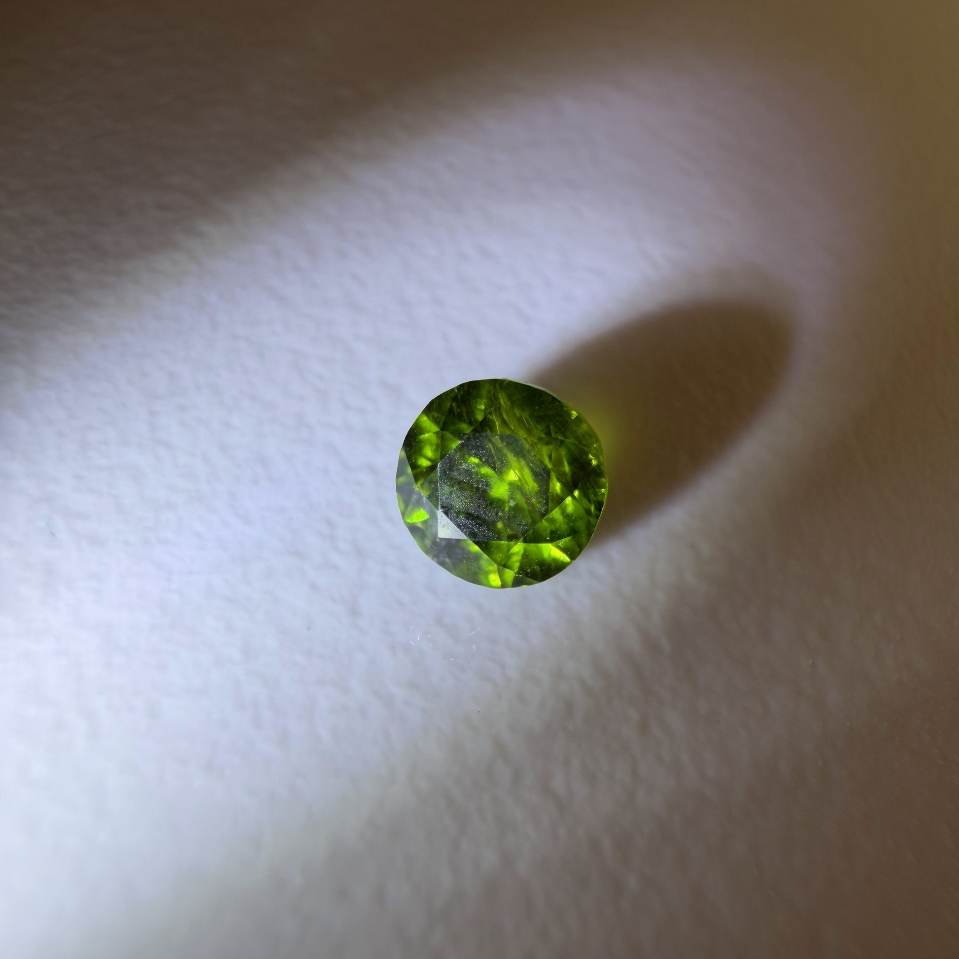 Green gemstone on a white background
