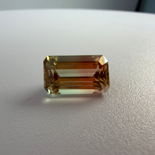 Rectangular gemstone on a light gray surface