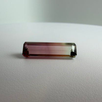 Rectangular gemstone on a white surface