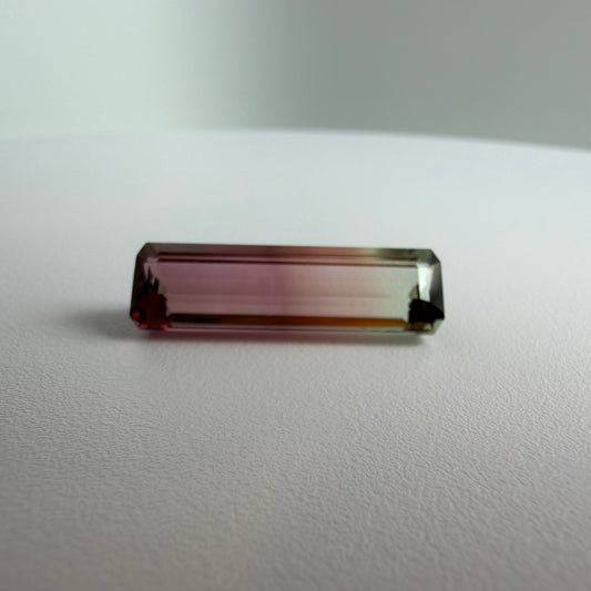 Rectangular gemstone on a white surface