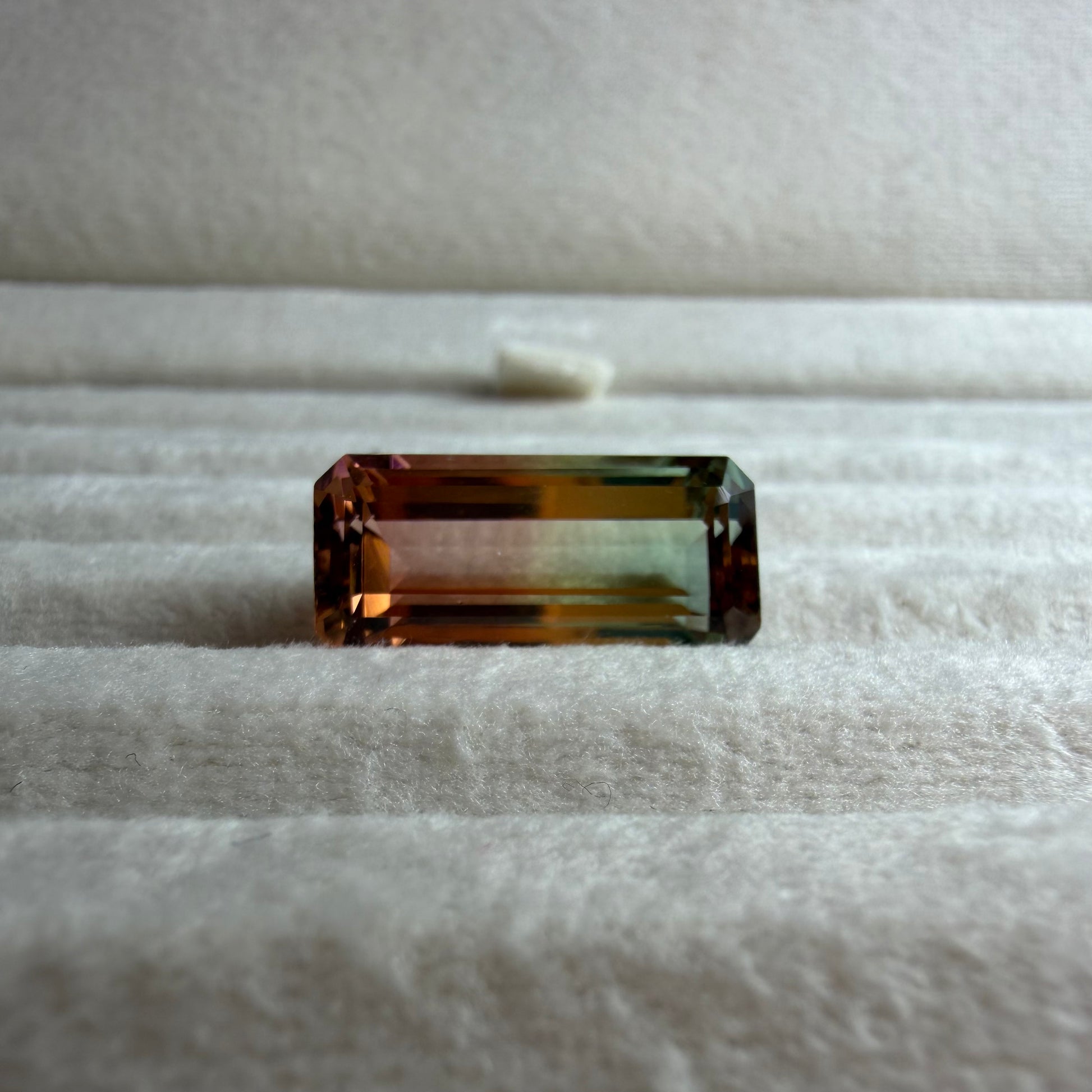 Rectangular gemstone on a textured surface