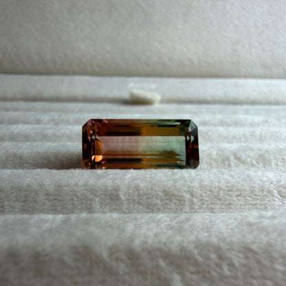 Rectangular gemstone on a textured surface