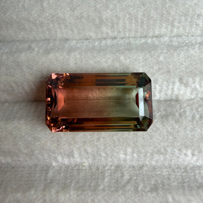 Rectangular gemstone on a textured gray background