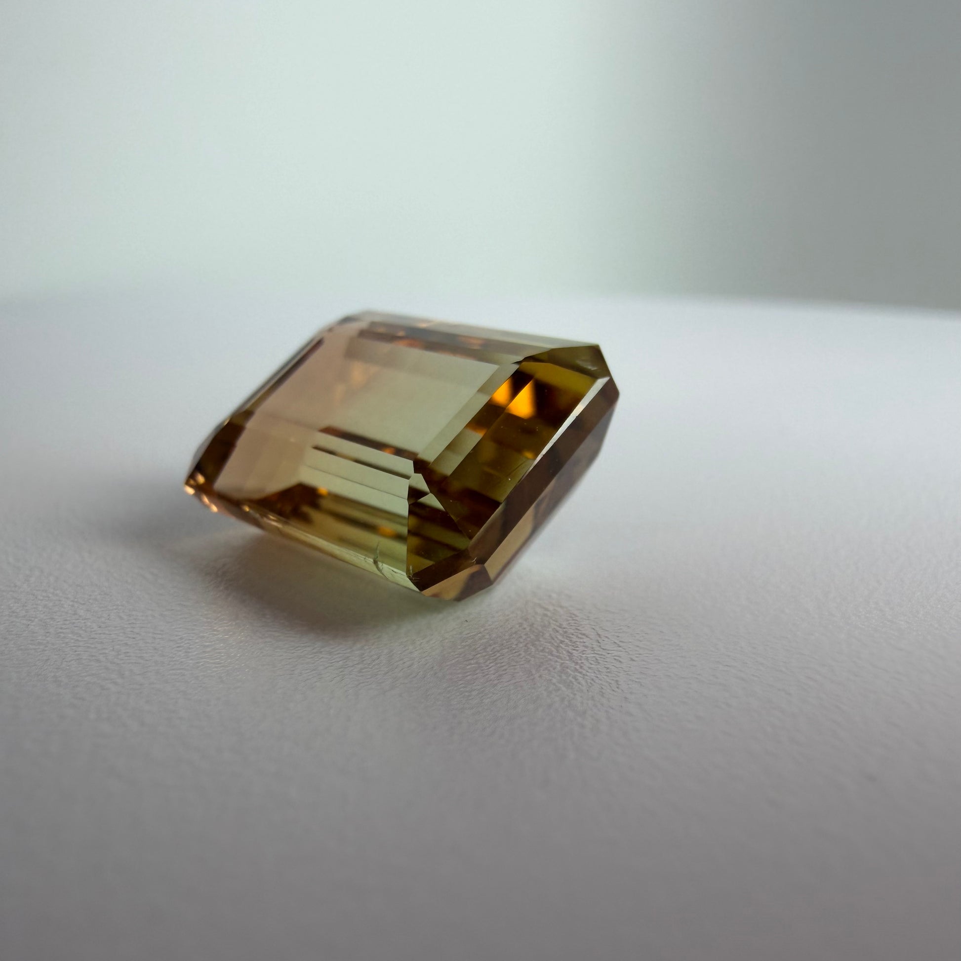 Faceted gemstone on a neutral background